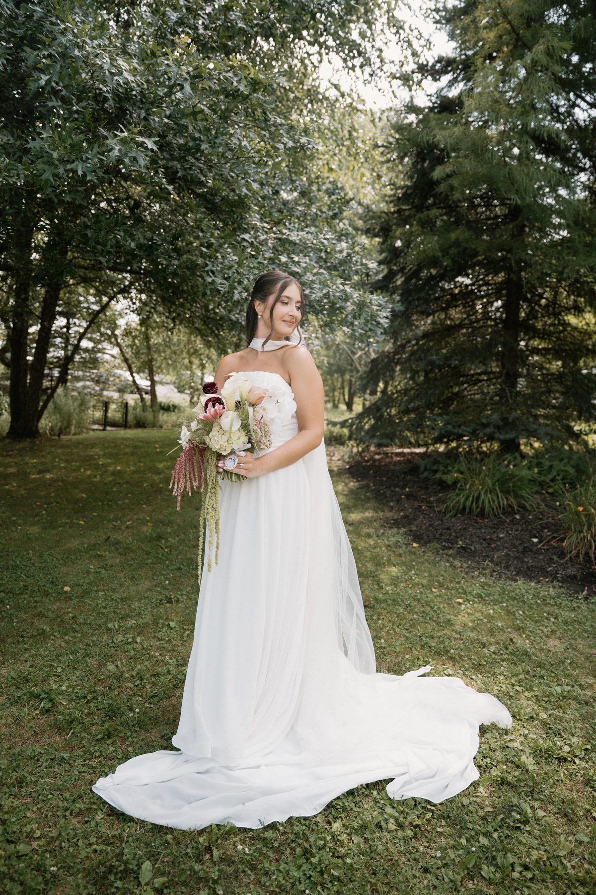 Bride with bouquet in a garden — luxury bridal makeup, Pittsburgh PA